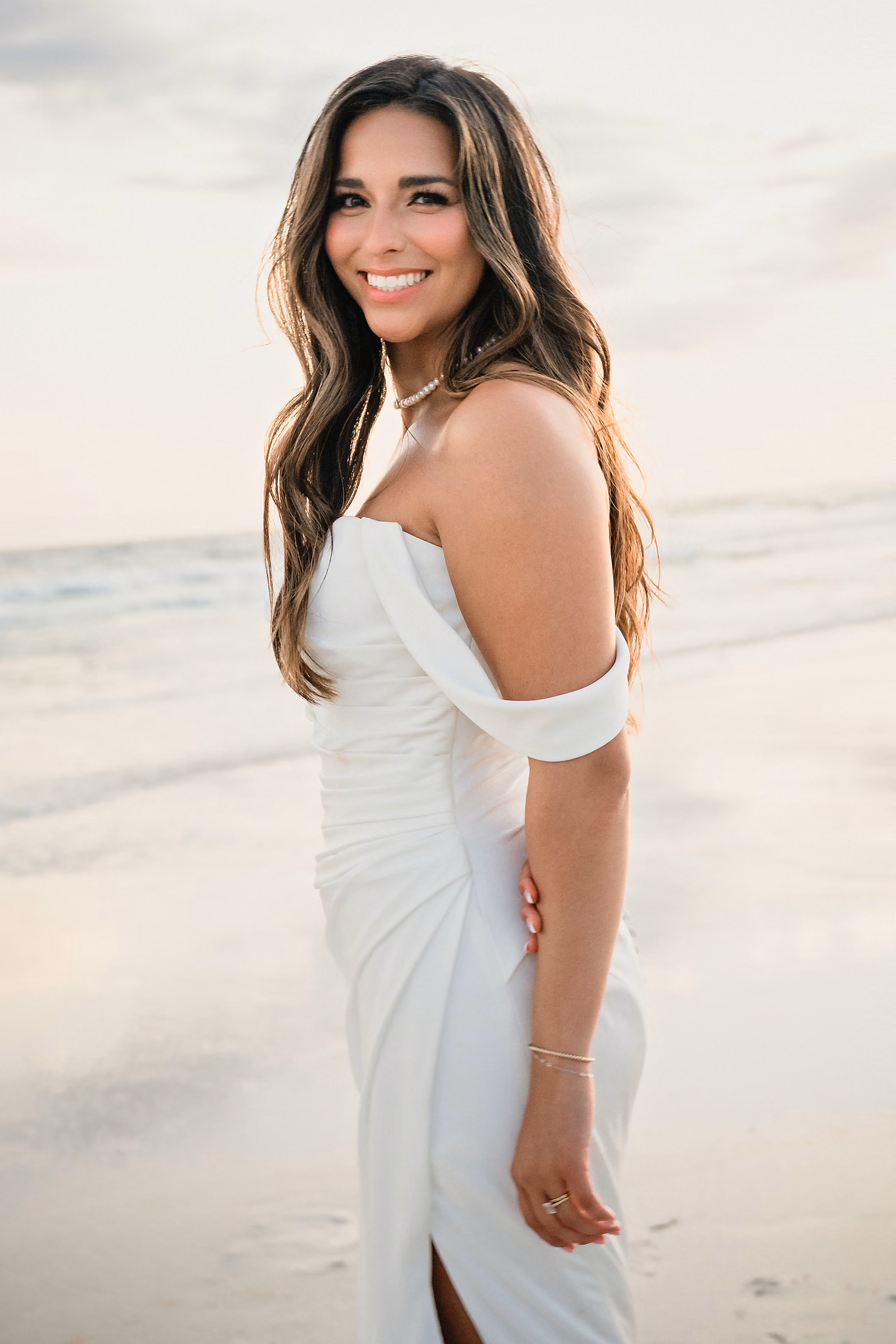 Bride in an off-shoulder gown on the beach