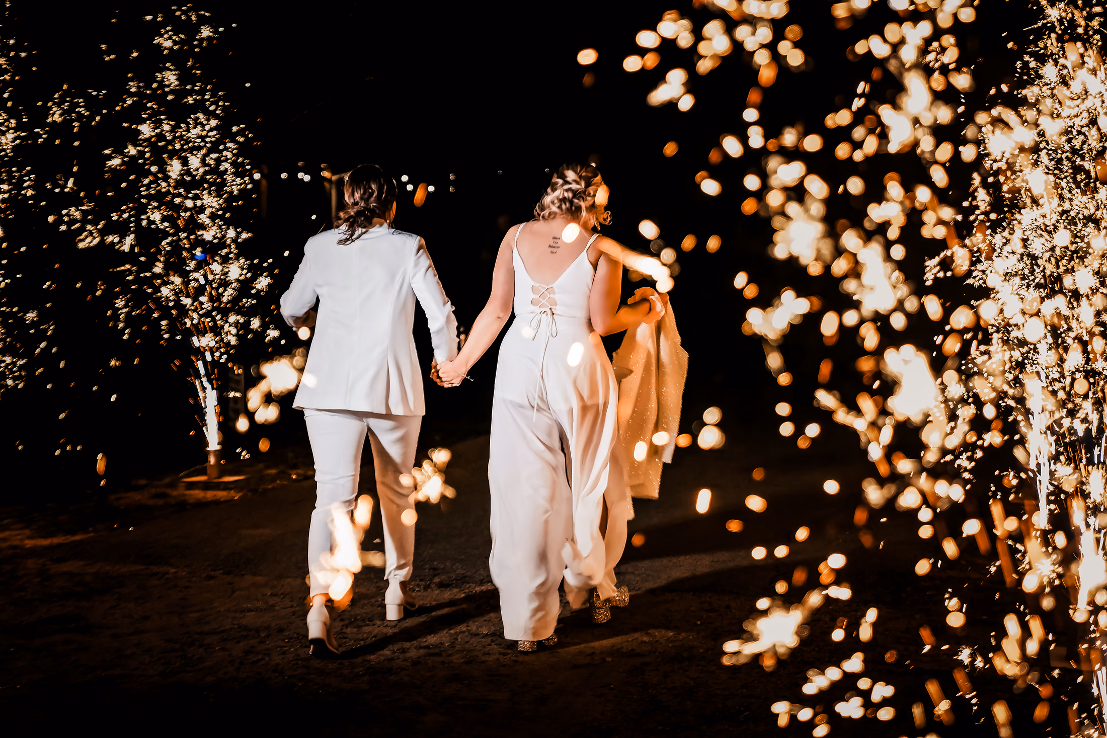 Bride and groom during a sparkler exit at the reception