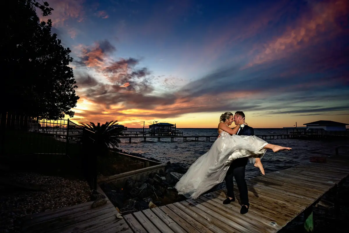 Gulf Coast wedding couple at sunset photographed by 8nfinity Photography