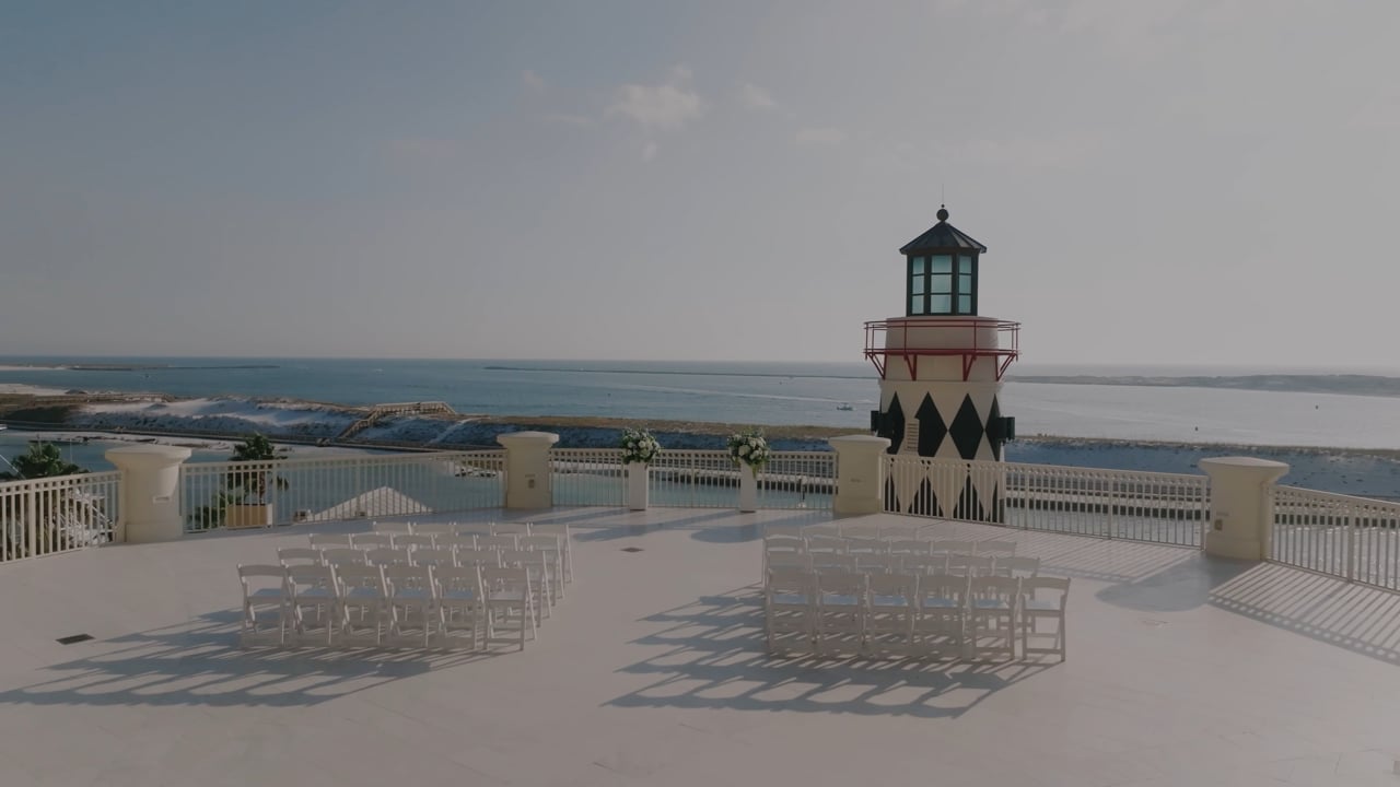 Coastal ceremony overlooking a lighthouse