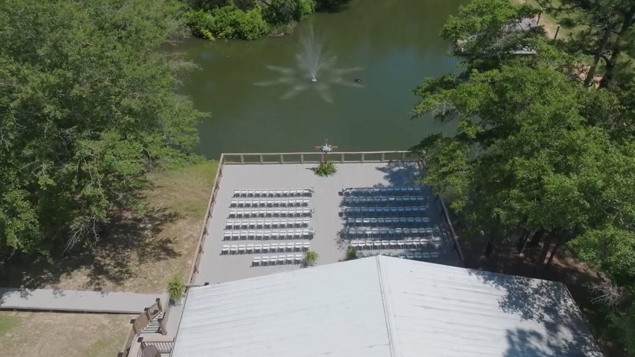 Aerial view of a ceremony beside a pond