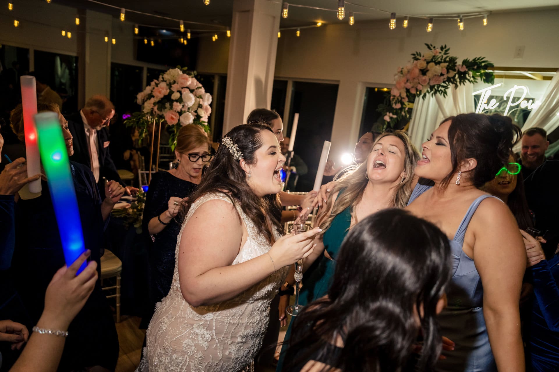 Neon sign lighting the reception at Pier Suites Pensacola Beach wedding