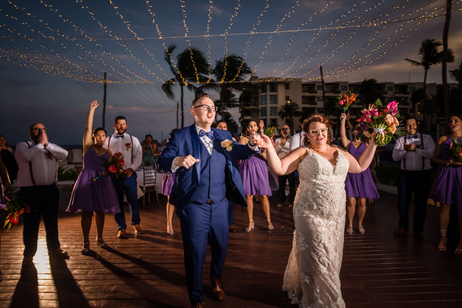 Mary and Austin glowing at their Dreams Riviera Cancun wedding reception in Mexico
